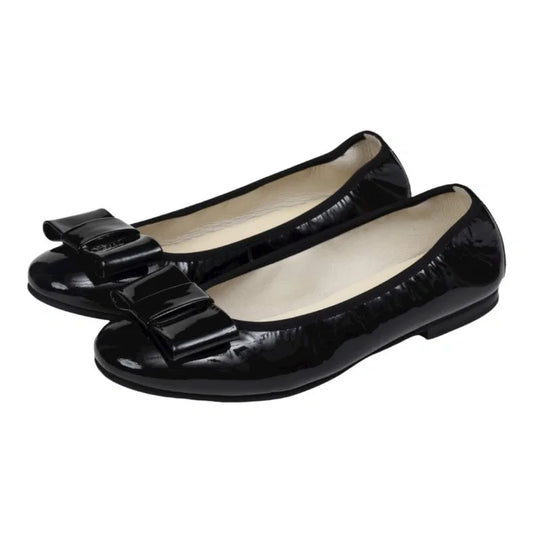 Black patent leather flats by London Kids, perfect for girls, teens, and women, with a stylish square bow detail.