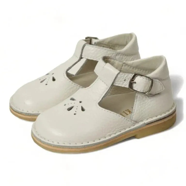 White soft leather strap shoes for toddlers and girls by London Kids, ideal for everyday wear or special occasions.