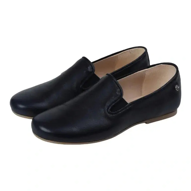 Navy soft leather slip-on shoes for boys and girls by Manuela de Juan, made in Spain.